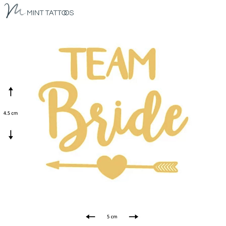 Temporary tattoo from Mint Tattoos. Metallic gold "Team Bride" with heart and arrow