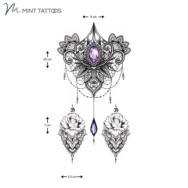 Temporary tattoo from Mint Tattoos. Main design centre is a purple faceted oval jewel surrounded by an abstract ornamental design. 2 smaller additional designs. 