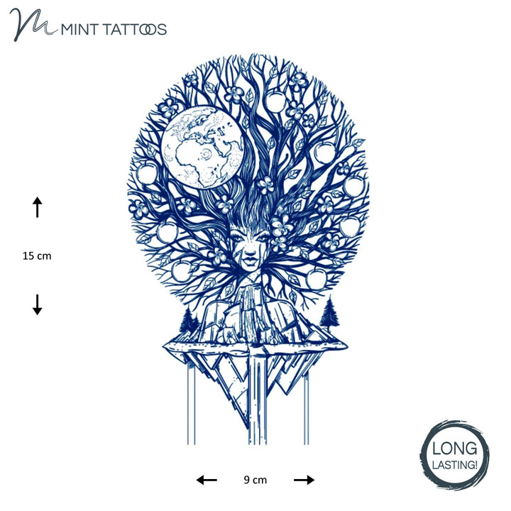 Long lasting temporary tattoo. Ink blue collage design with a women whose hair is the branched of a tree with fruit; on a round base with a few trees