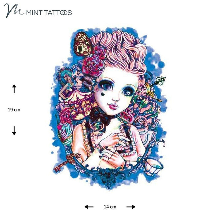 Temporary tattoo from Mint Tattoos. Brightly color collage, cartoon style image, of a doll in a dress with a blue background and various carnival props surrounding her