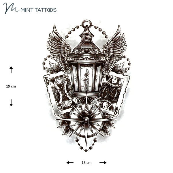 Temporary tattoo from Mint Tattoos. Shaded and intricate design of a lantern with wings and a compass, king and queen face cards and more