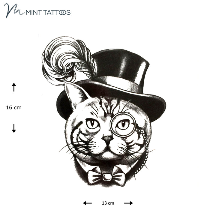 Temporary tattoo from Mint Tattoos. Round faced tabby cat with a feathered top hat, monocle and a bow tie