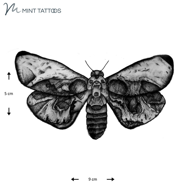 Temporary tattoo from Mint Tattoos.  Black shaded moth with subtle skulls hidden in the wing pattern