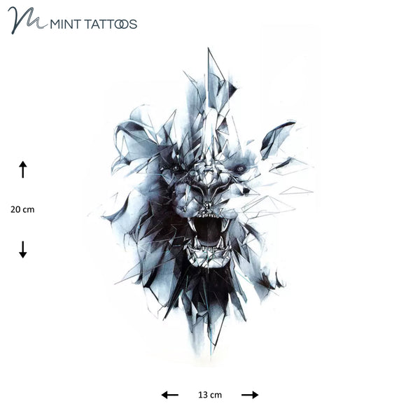 Temporary tattoo from Mint Tattoos. Just the face, not head, of a lion with mouth open. Outer edges appearing to break of glass. Dark shaded tattoo, measures 13 x 20 cm