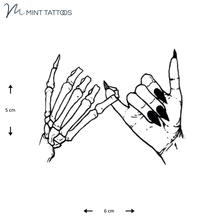 Temporary tattoo from Mint Tattoos.  One skeletal hand and one female hand with long nails, both with their pinky fingers together