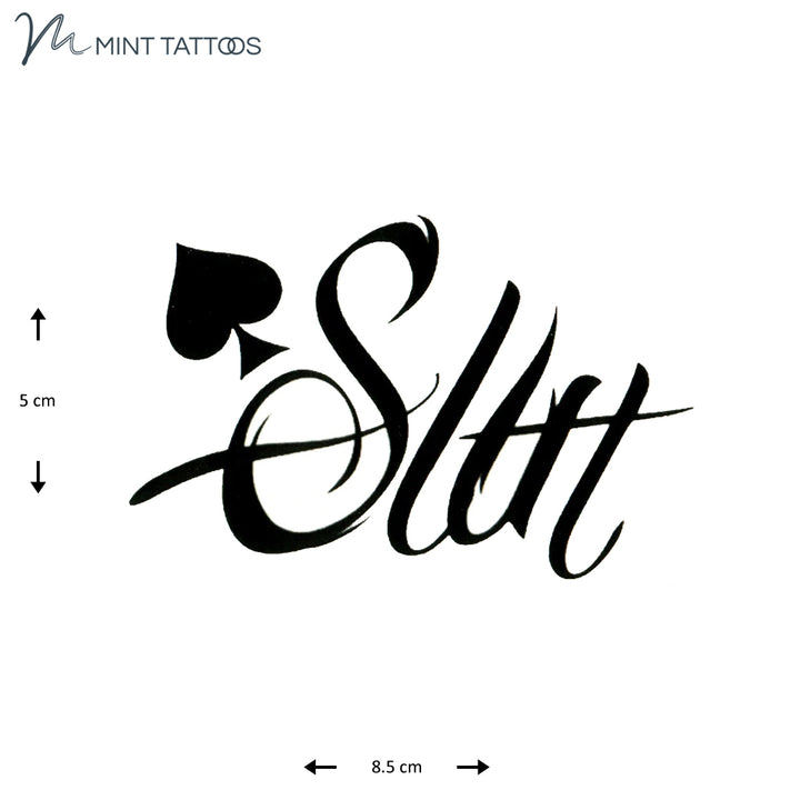 Temporary tattoo from Mint Tattoos. Single script word, Slut, appears with a small spade. 5 x 8.5 cm