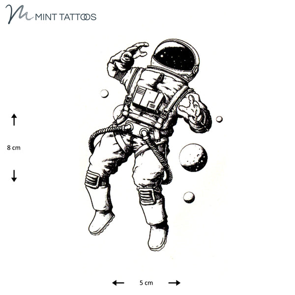 Temporary tattoo from Mint Tattoos. Hand drawn astronaut floating in space. Measures 5 x 8 cm