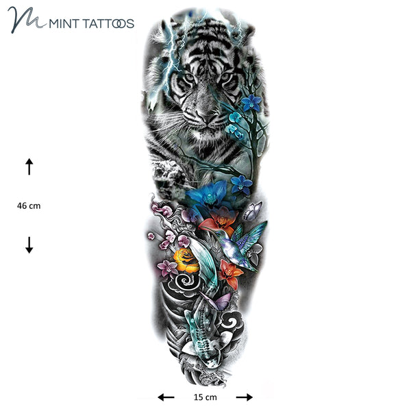 Full sleeve temporary tattoo. A collage including a tiger, koi fish, hummingbird, lightning. Design is mainly black with a few colored elements throughout
