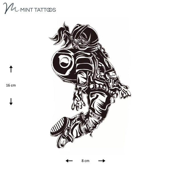 Temporary tattoo from Mint Tattoos. Hand drawn astronaut floating in space. Measures 8 x 16 cm