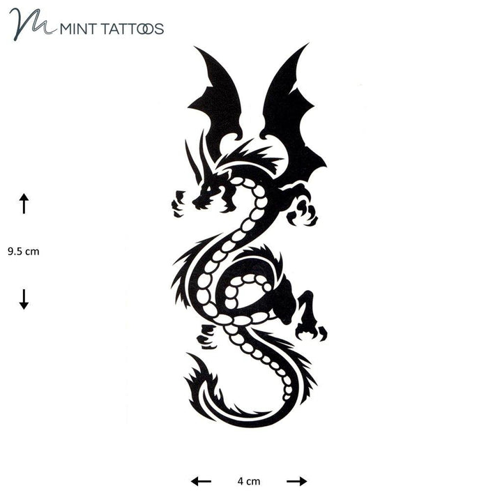 Temporary tattoo from Mint Tattoos. Bold black roaring dragon has wings flared and claws drawn