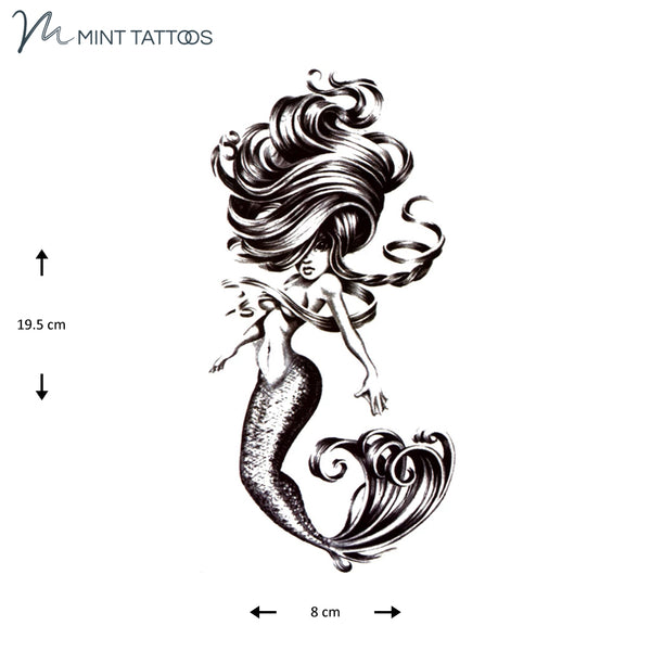 Temporary tattoo from Mint Tattoos. Black hand drawn sassy mermaid with swirling hair and visibly scaly tail